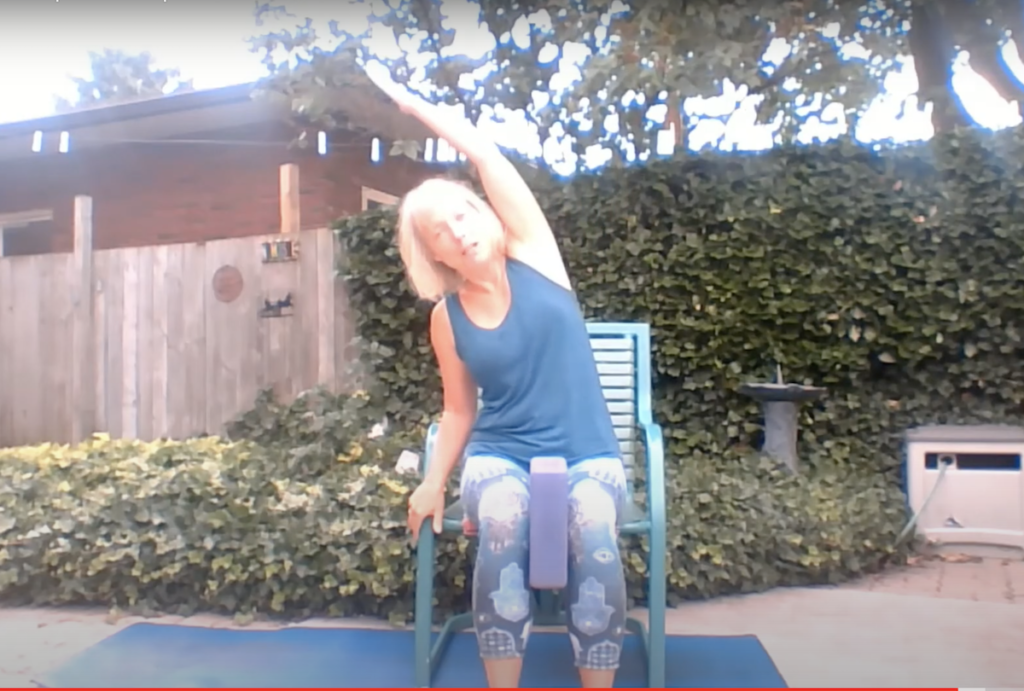 Using a chair can make yoga poses accessible for women over 50 with sore knees or hips.